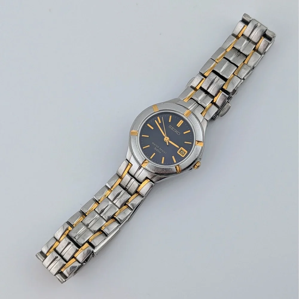 Seiko 7N82-0AG0 Blue Sunburst Two Tone Date Quartz Watch 50M‎
